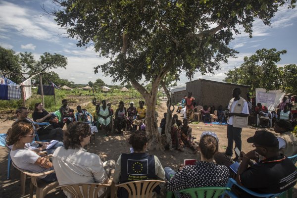 community meeting with local officer in Uganda